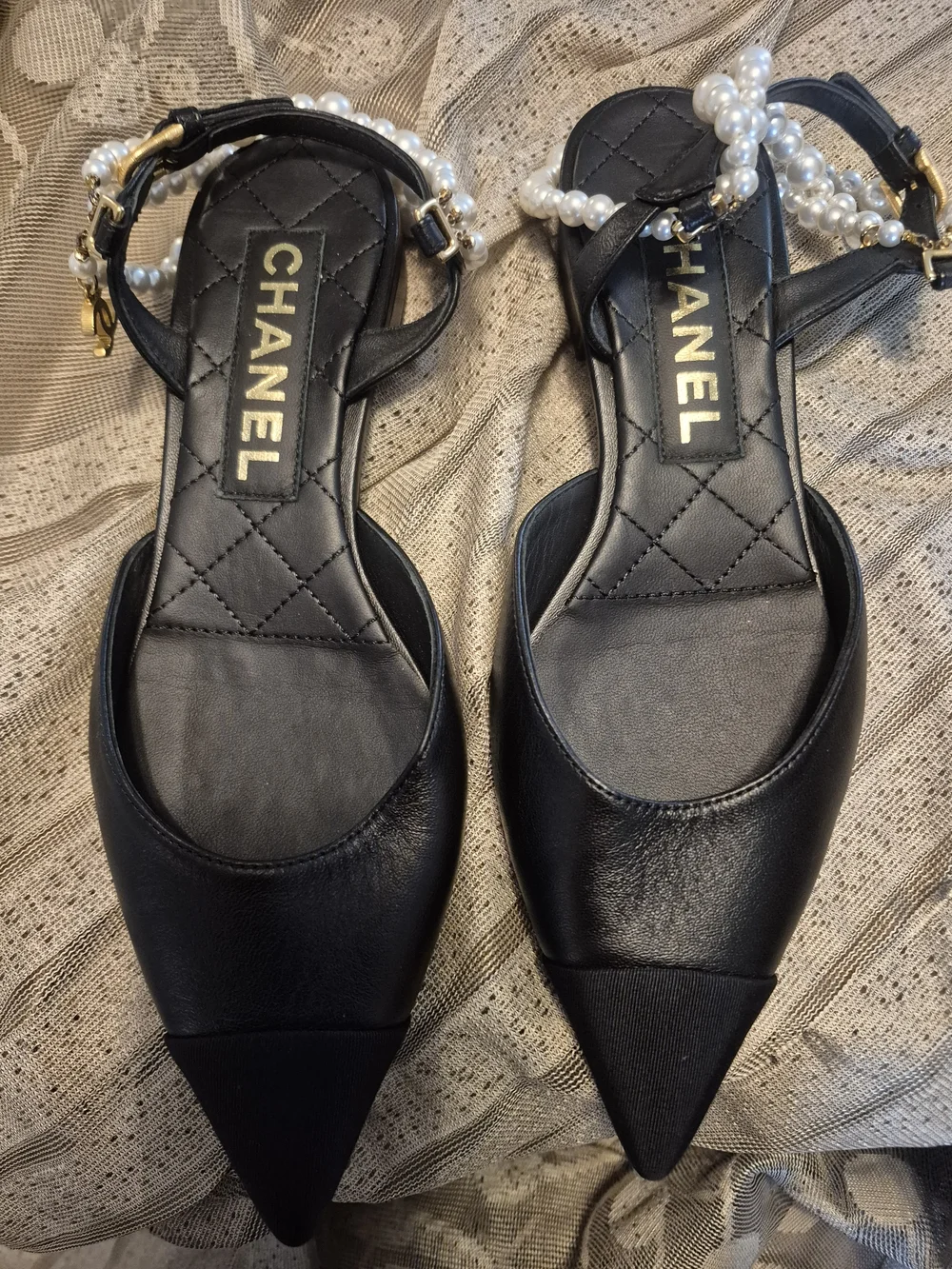 CHANEL black leather pointed-toe flats with pearls